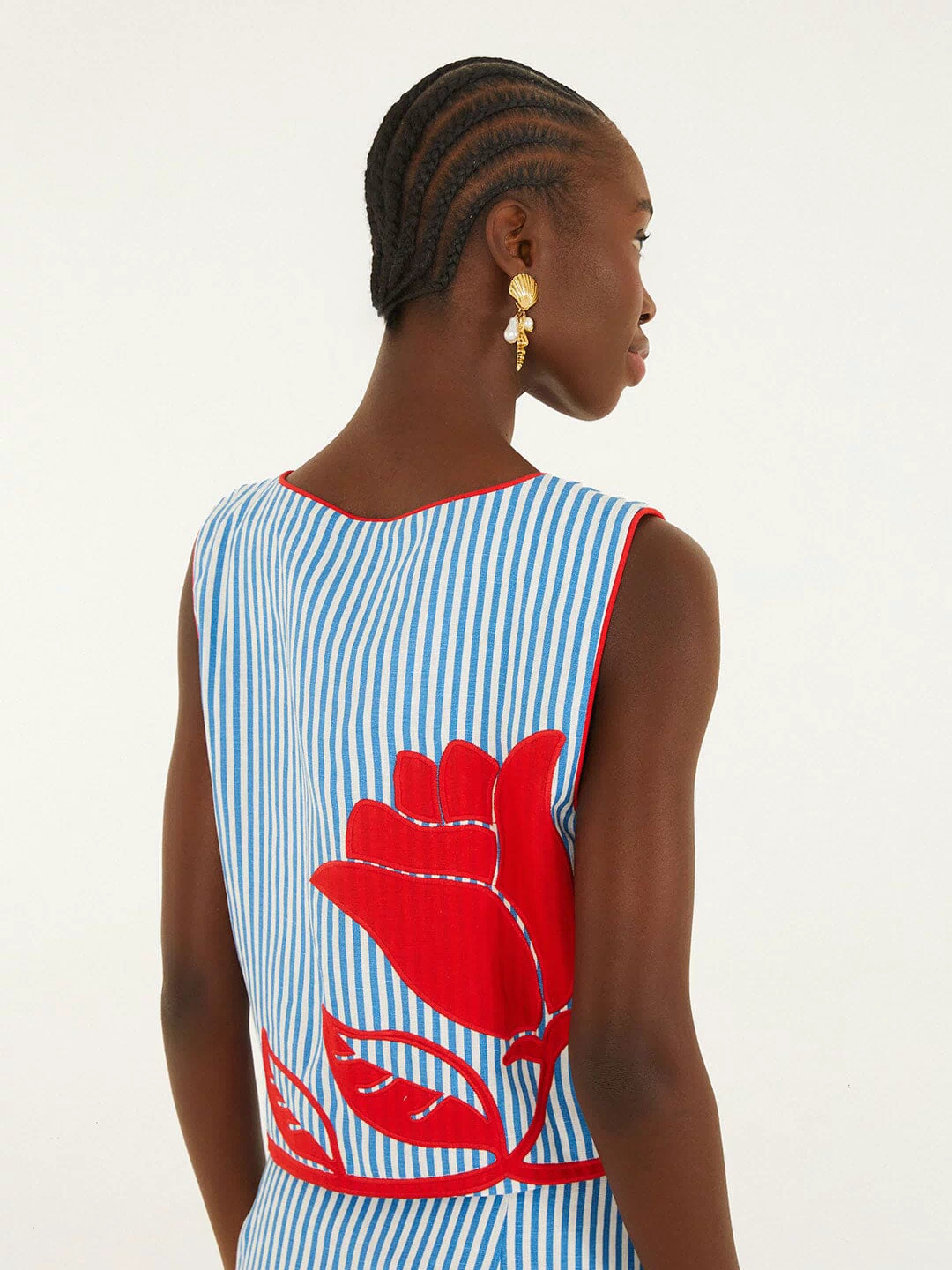 FARM Rio model wearing the Sky Stripes Blue Sleeveless Crop Top