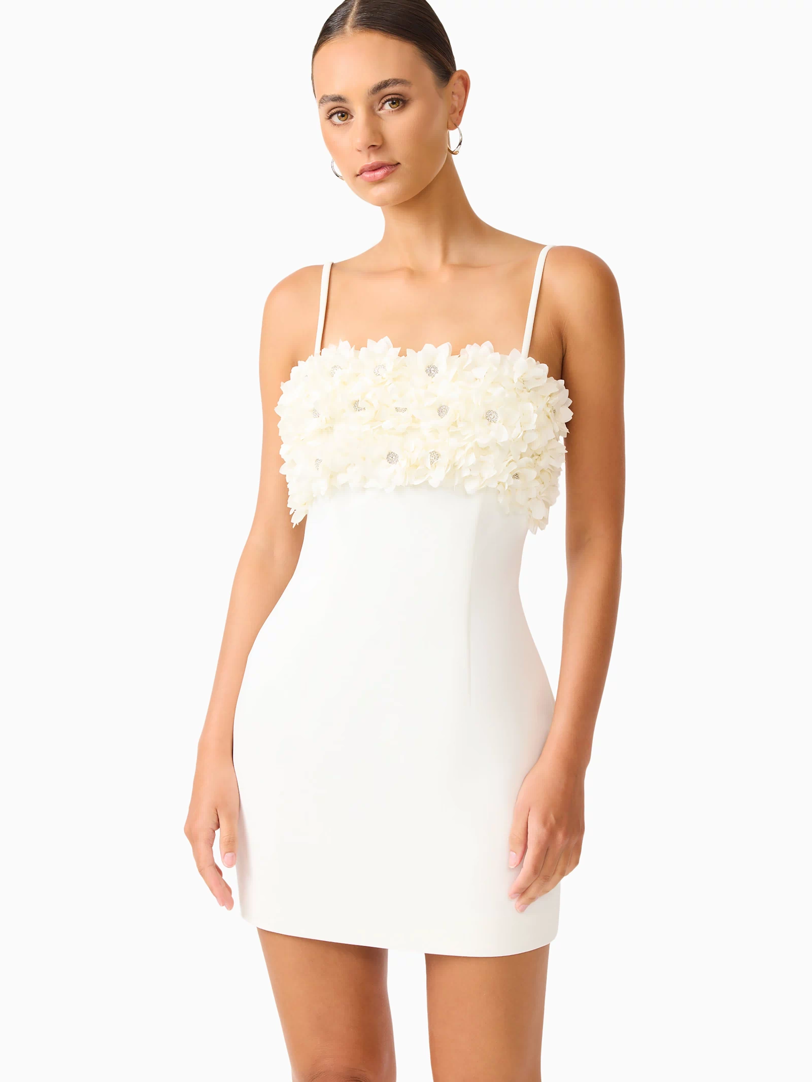 Solenne Party Mini Dress in White with a 3D floral detail close up shot