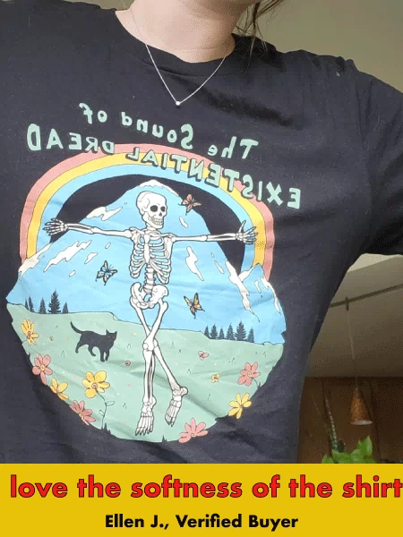 Black graphic tee with skeleton under rainbow in nature scene, text 'Sound of Existential Dread'