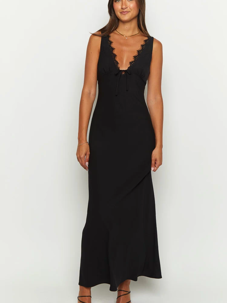 Black maxi dress with a deep V-neckline, delicate lace trim, and a tie-front detail