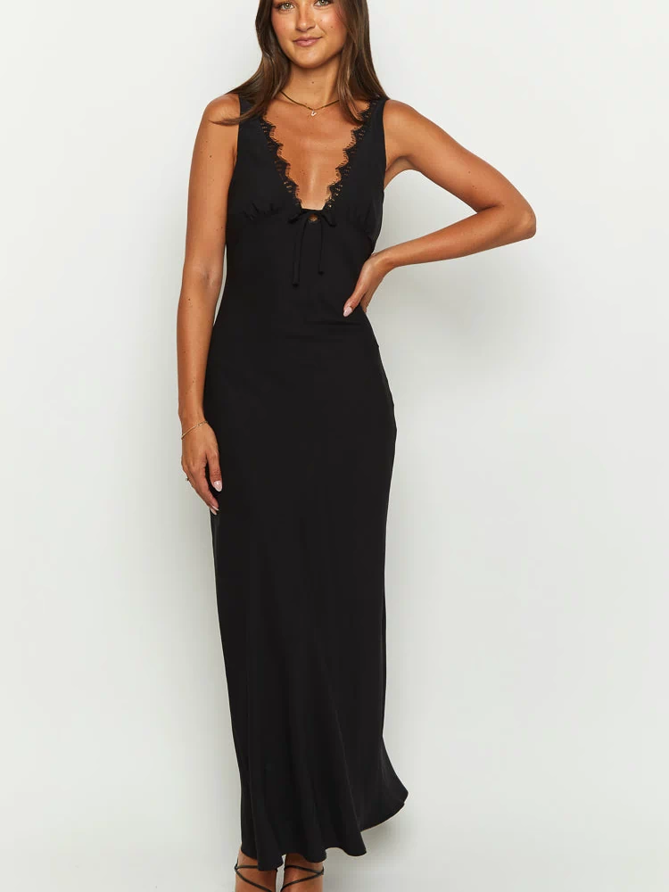Black sleeveless V-neck maxi dress with lace trim and a front tie detail, flowing to the floor