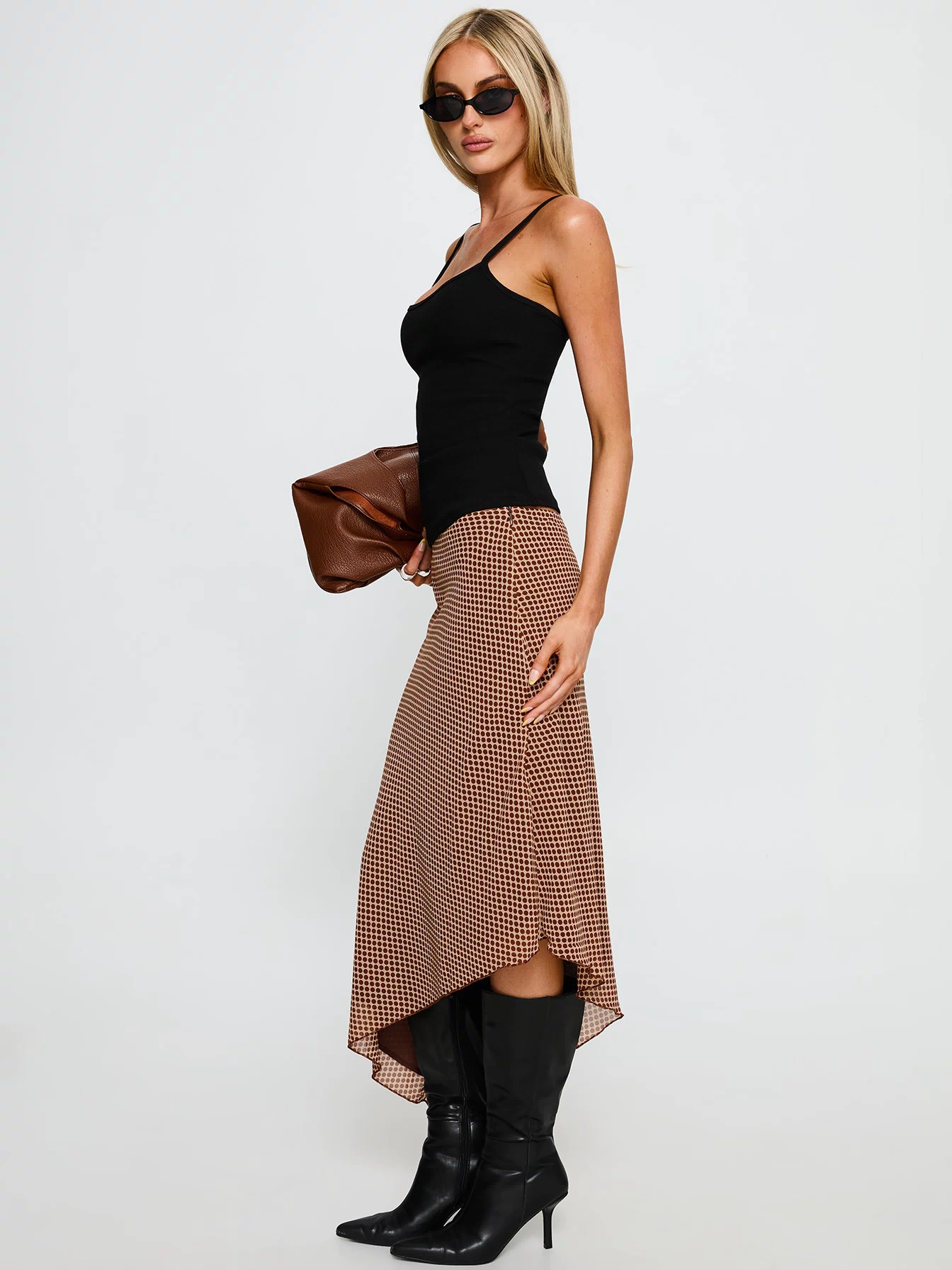   side view of model wearing Princess Polly Suella Asymmetrical Midi Skirt Brown Polka Dot Midi Skirts 