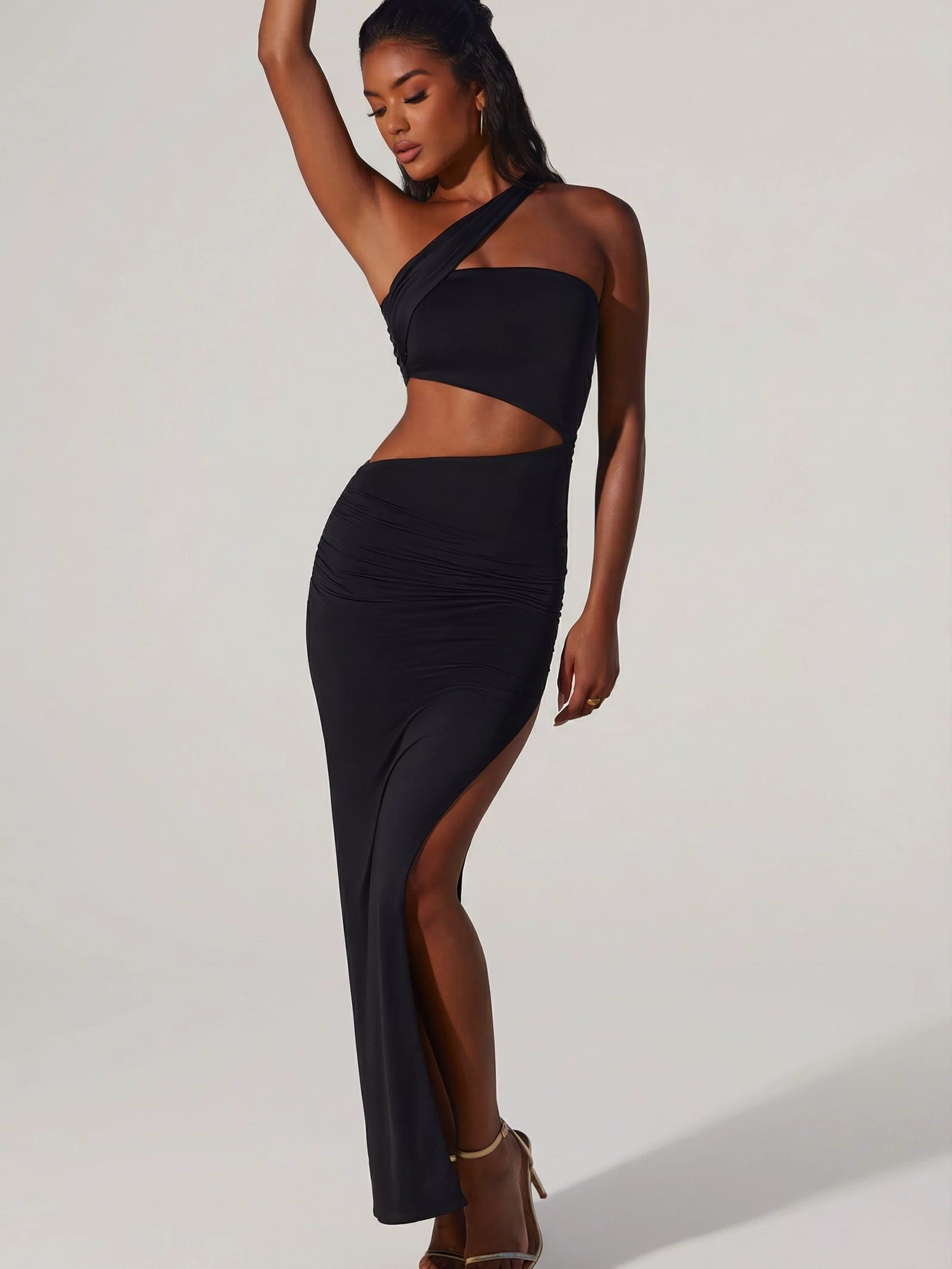 Oh Polly's Yarelis wearing the Suvi Maxi Dress in Black Slinky fabric perfect for a romantic dinner date