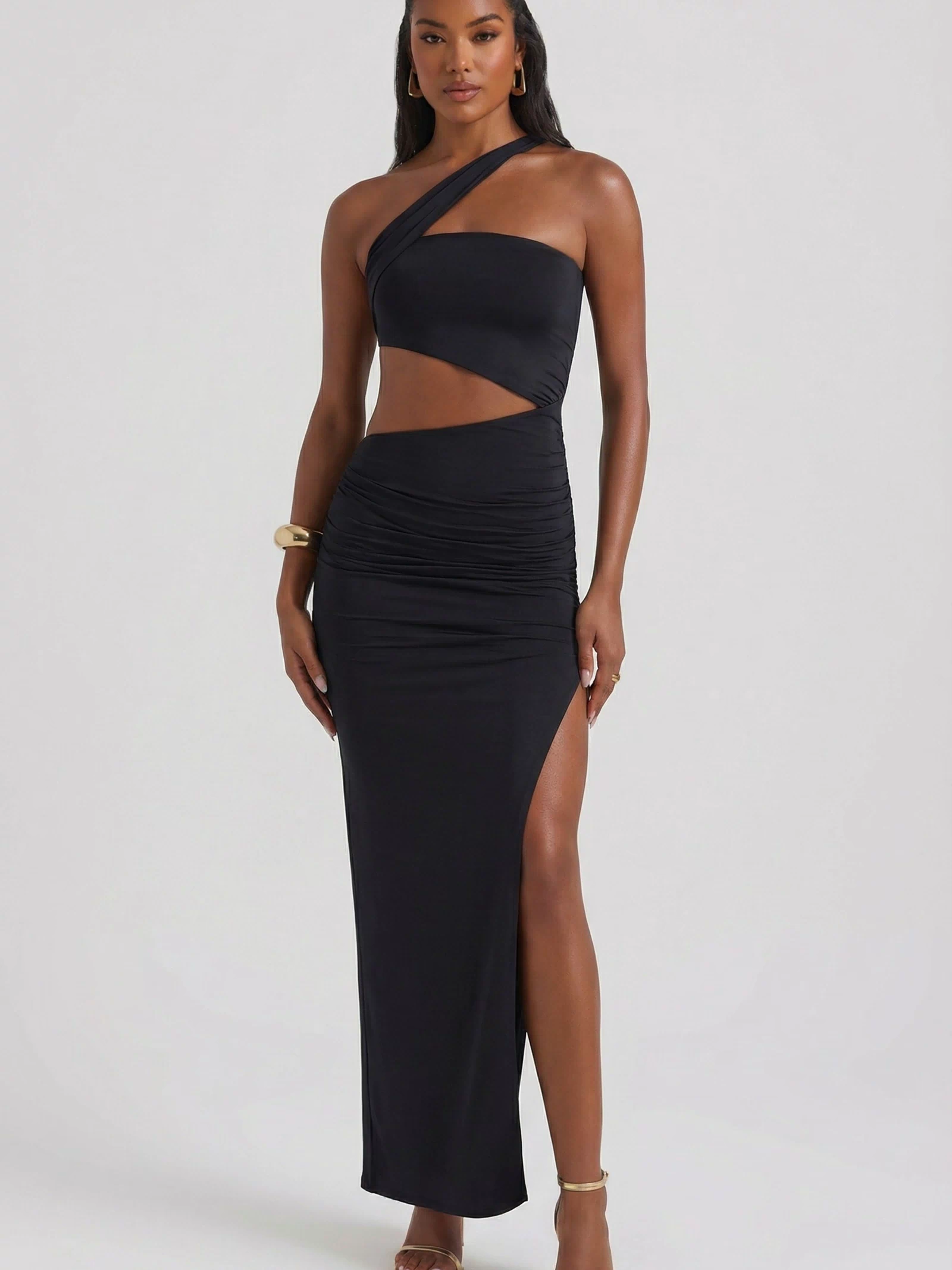 Oh Polly's Yarelis wearing the Suvi Maxi Dress in Black Slinky fabric perfect for romantic dinner dates