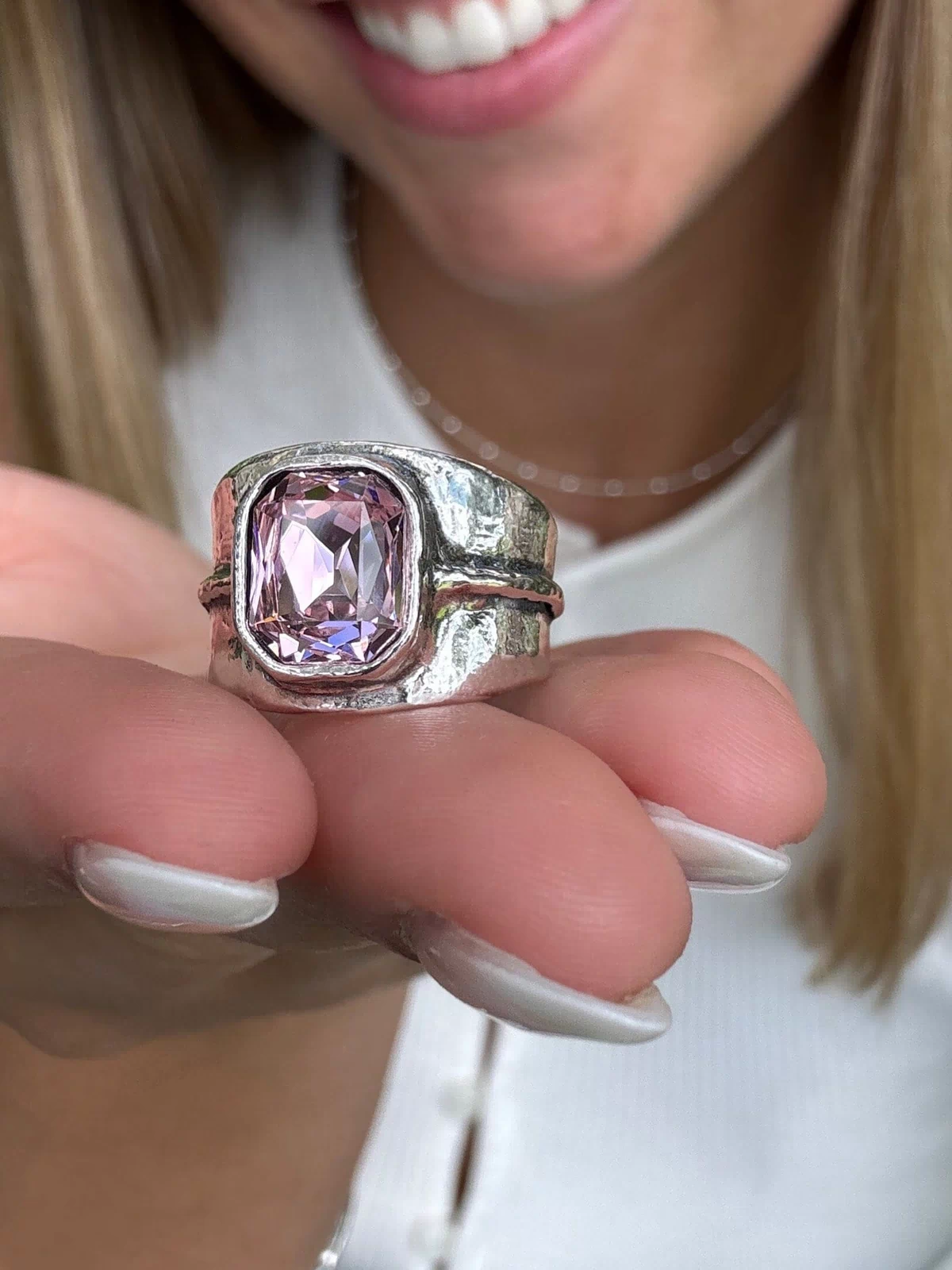 silver designer ring bezel set with a soft pink center stone