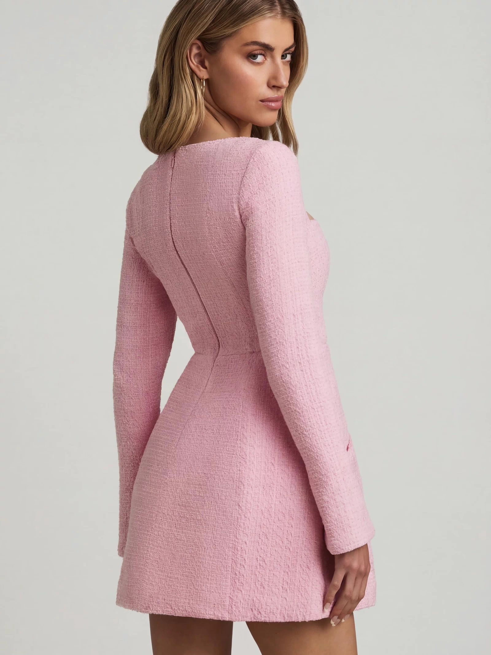 Oh Polly's Freya Tidy wearing the Tacita Mini Dress in Soft Pink Tweed fabric perfect for spring garden parties