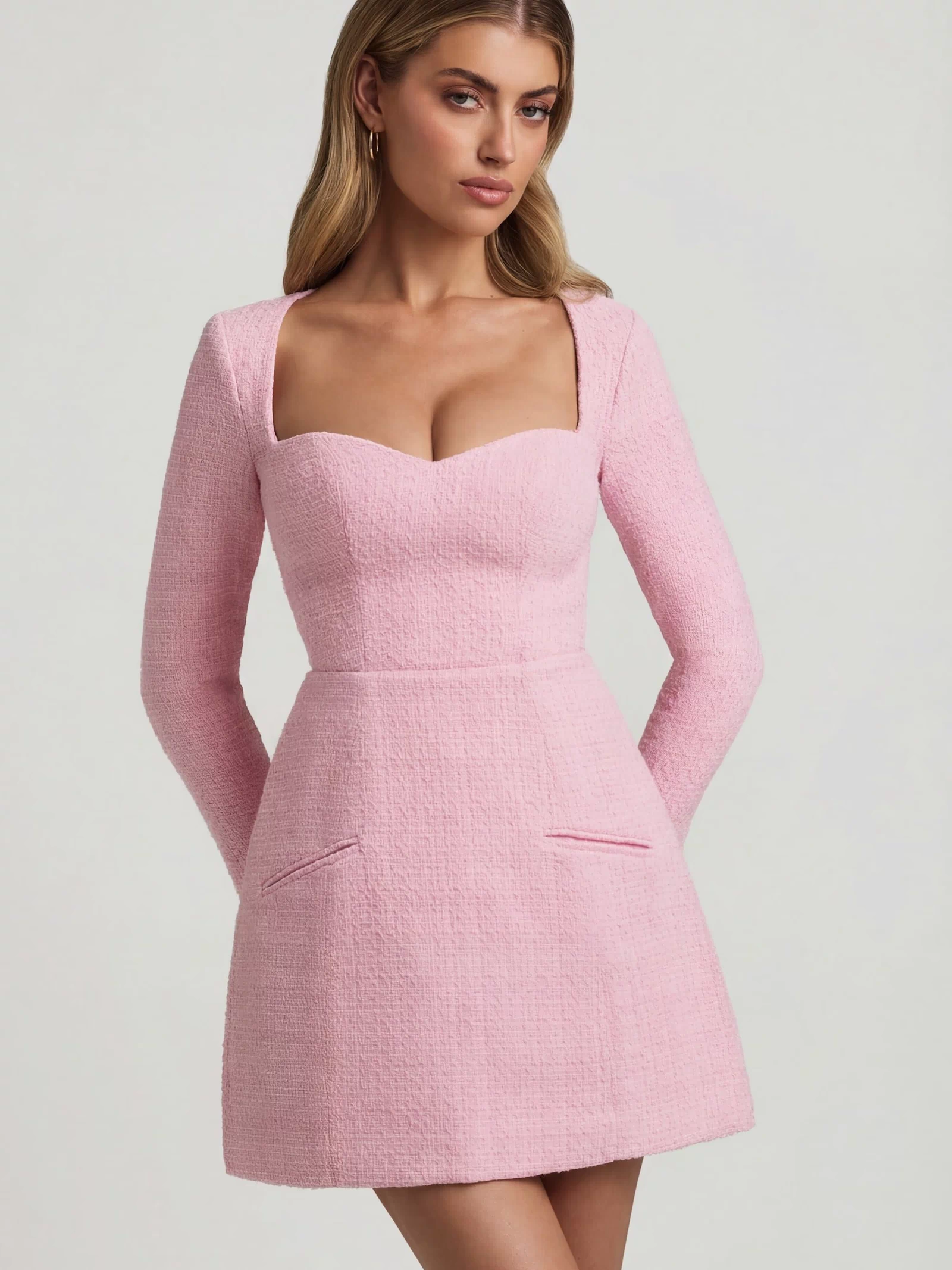 Oh Polly's Freya Tidy wearing the Tacita Mini Dress in Soft Pink Tweed fabric perfect for afternoon tea dates