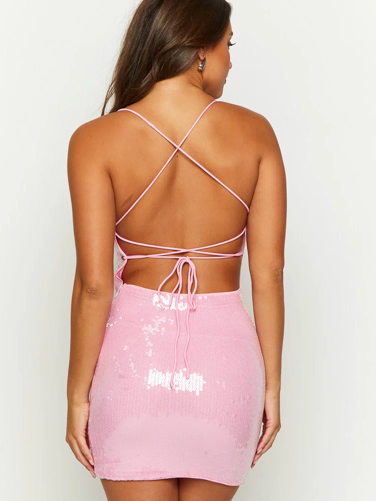 Close-up of the shimmering pink sequin mini dress with thin spaghetti straps and a fitted silhouette