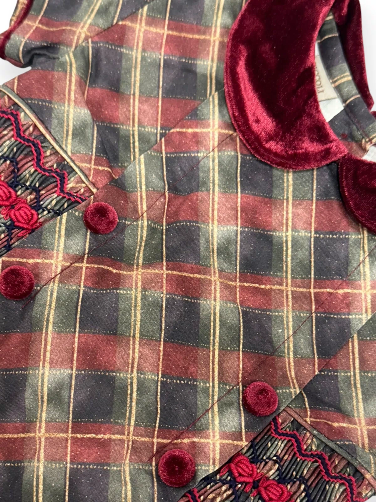Close-up of handsmocking and velvet neckline on Tartan Luxe Dress