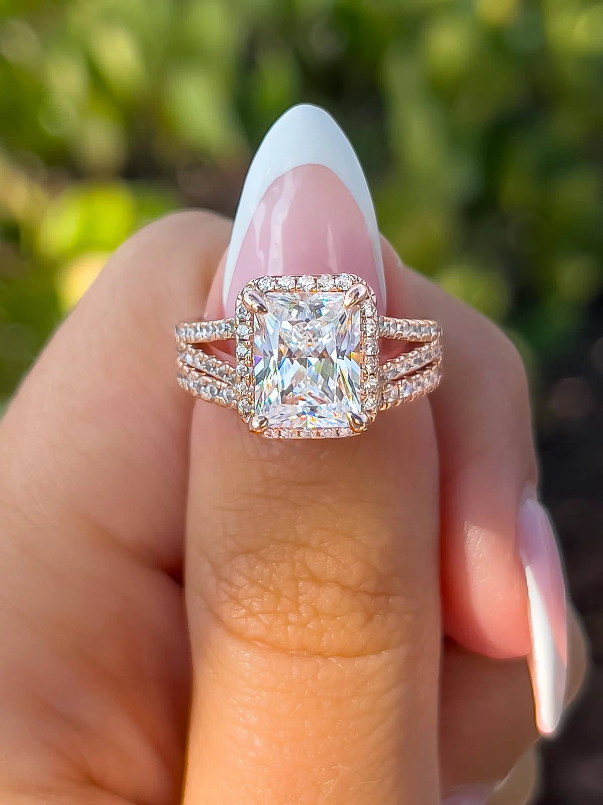 classic rose gold 3.5 carat radiant cut wedding ring set on female model with complimentary wedding band