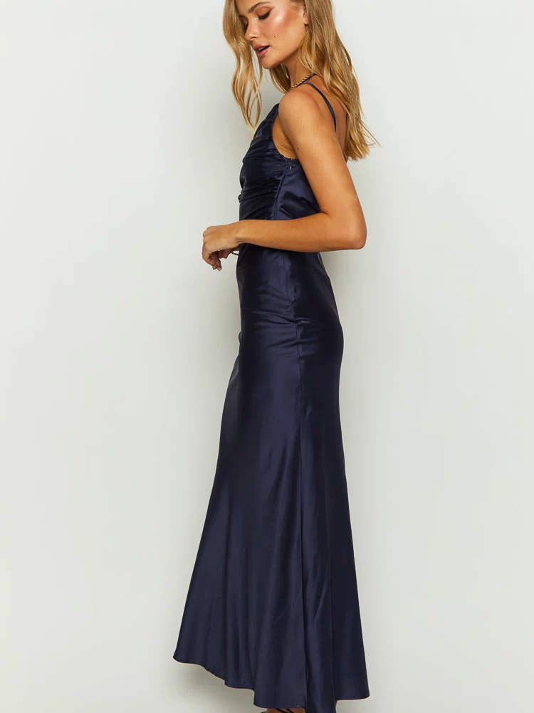Side view of a navy satin maxi dress showing the ruched bodice and flowing skirt