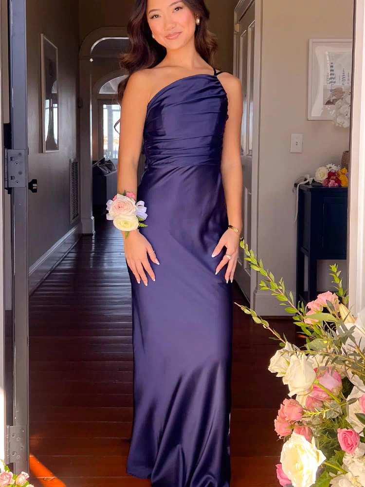 Navy satin one-shoulder formal maxi dress with draped bodice and flowing skirt