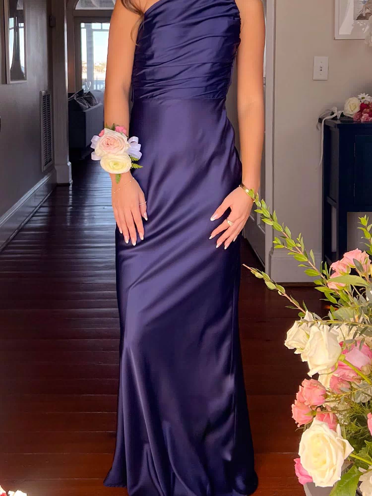 Navy satin one-shoulder maxi dress with a ruched bodice and flowing skirt