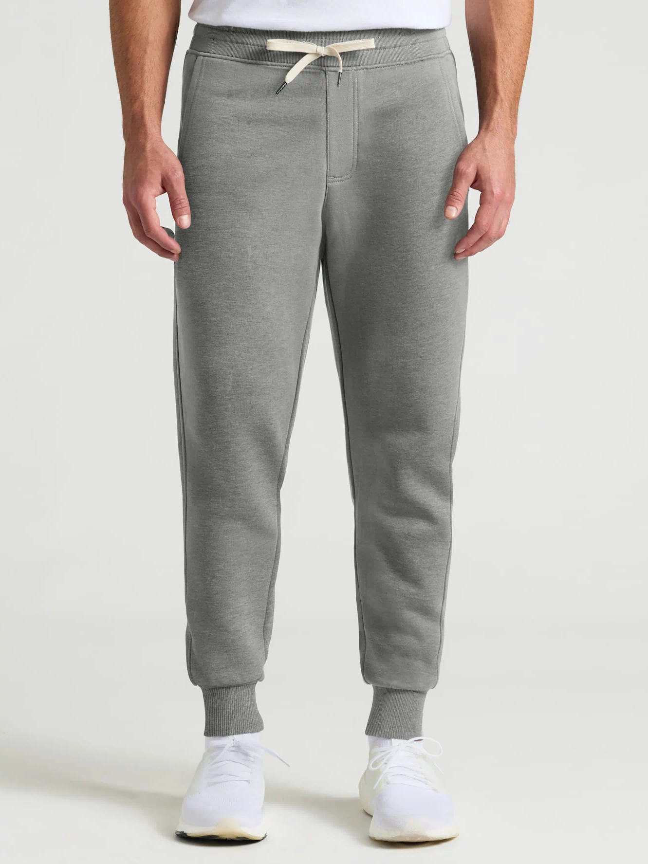 Medium Heather Gray Joggers with pockets, drawstring, and ribbed cuffs.