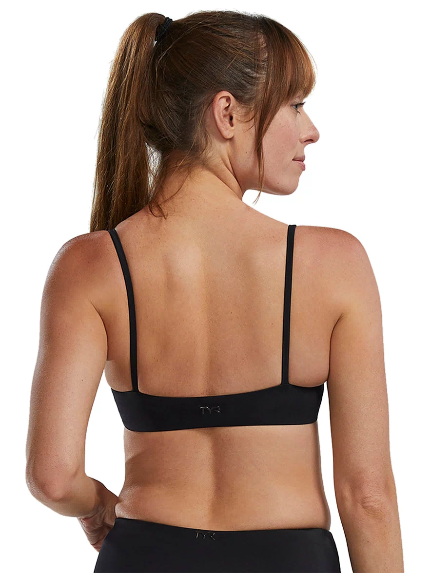 TYR black bikini top designed for active recreation, featuring thin straps and a sleek back design. Ideal for swimming and beach activities, this stylish top combines comfort and performance. Perfect for those seeking high-quality swimwear with a minimalist look.