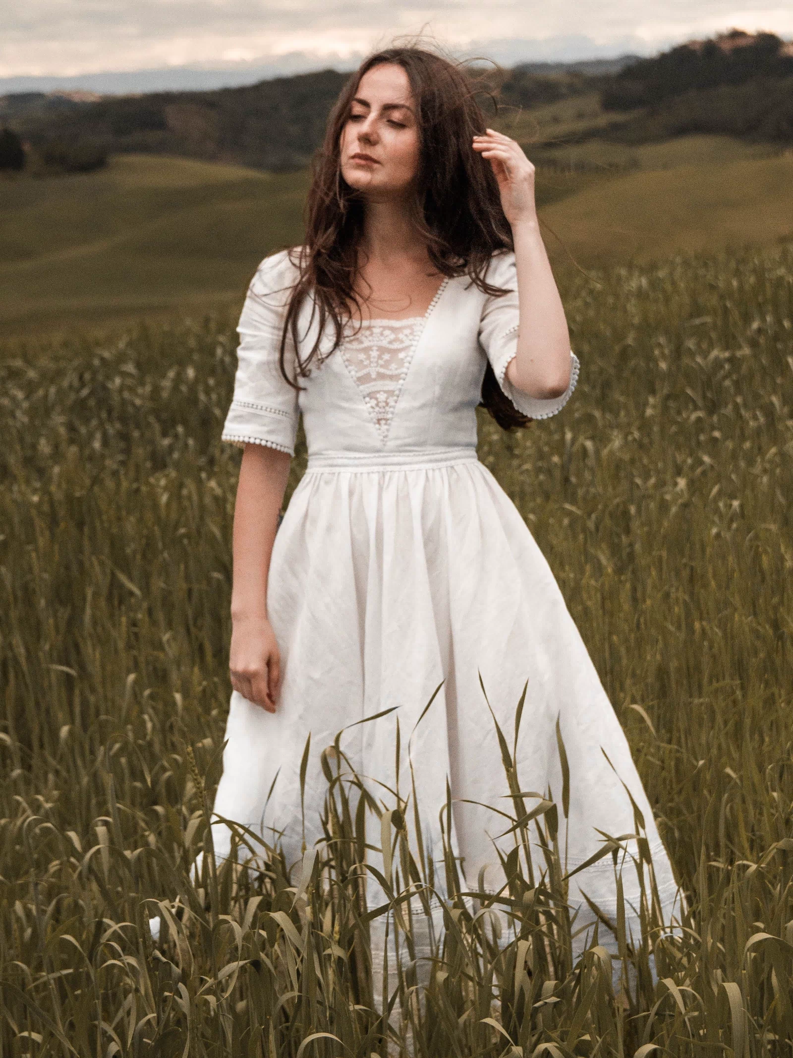 under-the-tuscan-sky-ivory-wedding-dress-back-view
Back view of the Under the Tuscan Sky ivory linen wedding dress photographed among olive trees