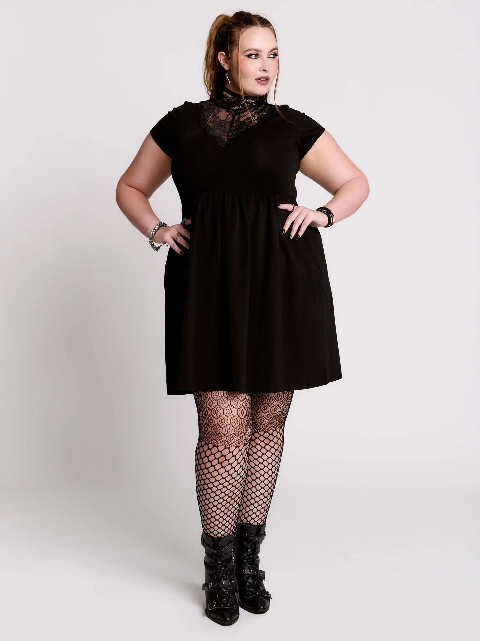 A black short-sleeve dress with a lace V-neckline.
