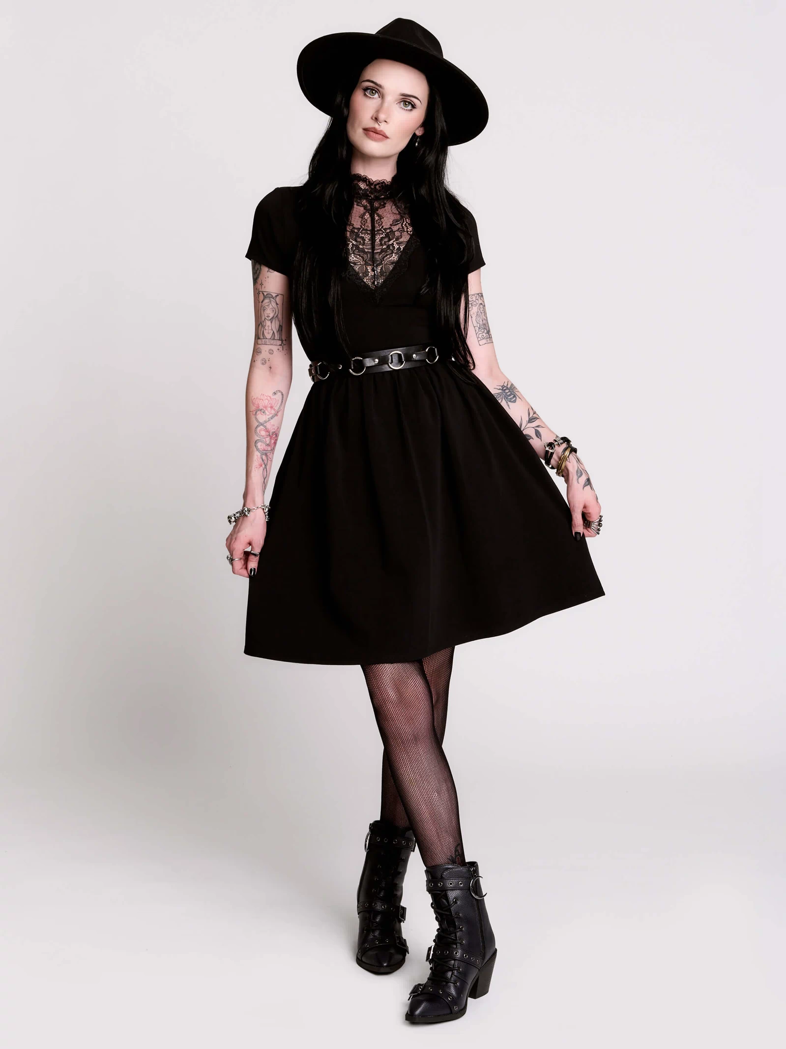 A black short-sleeve dress with a lace V-neckline.