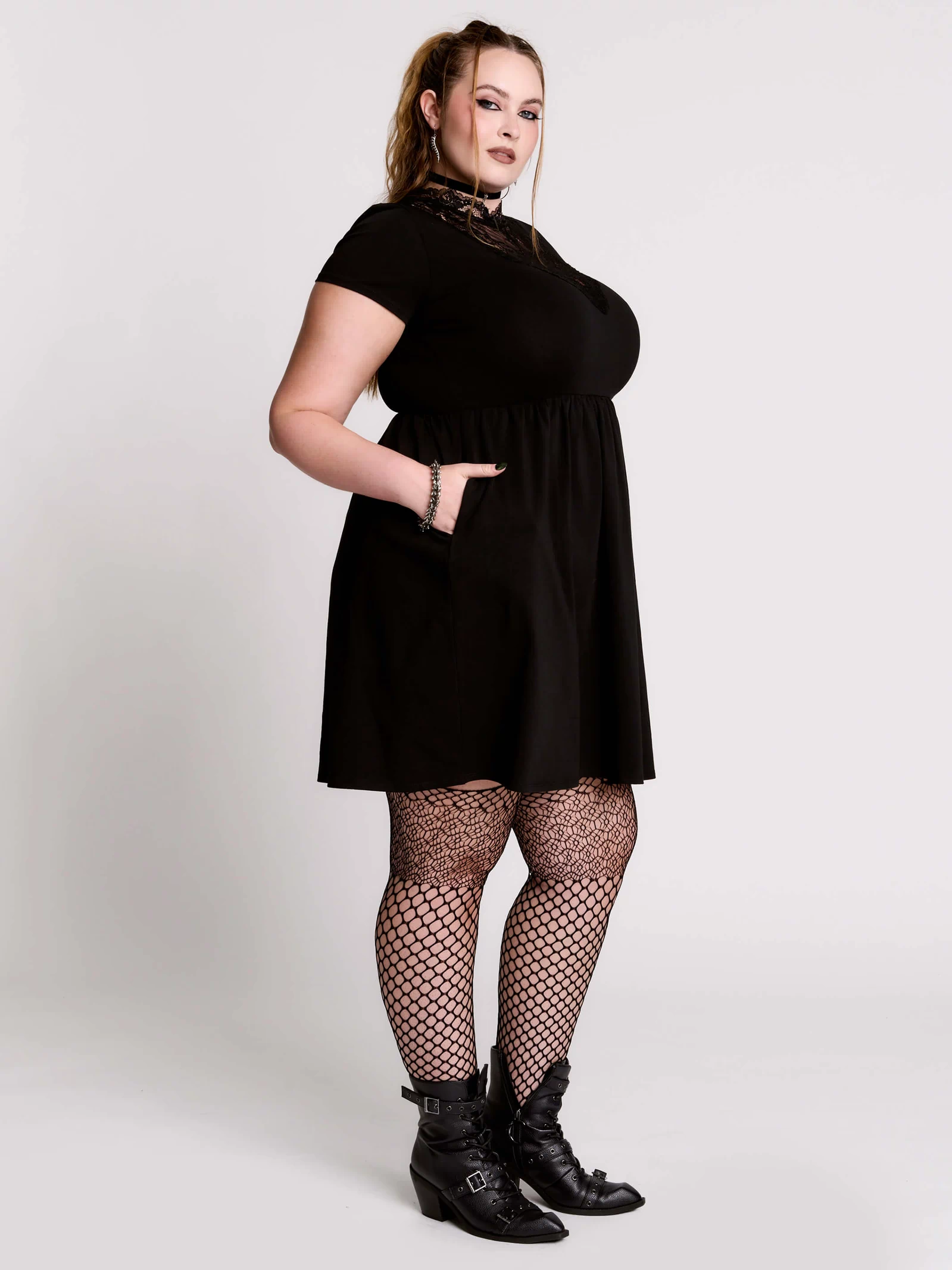 A black short-sleeve dress with a lace V-neckline.