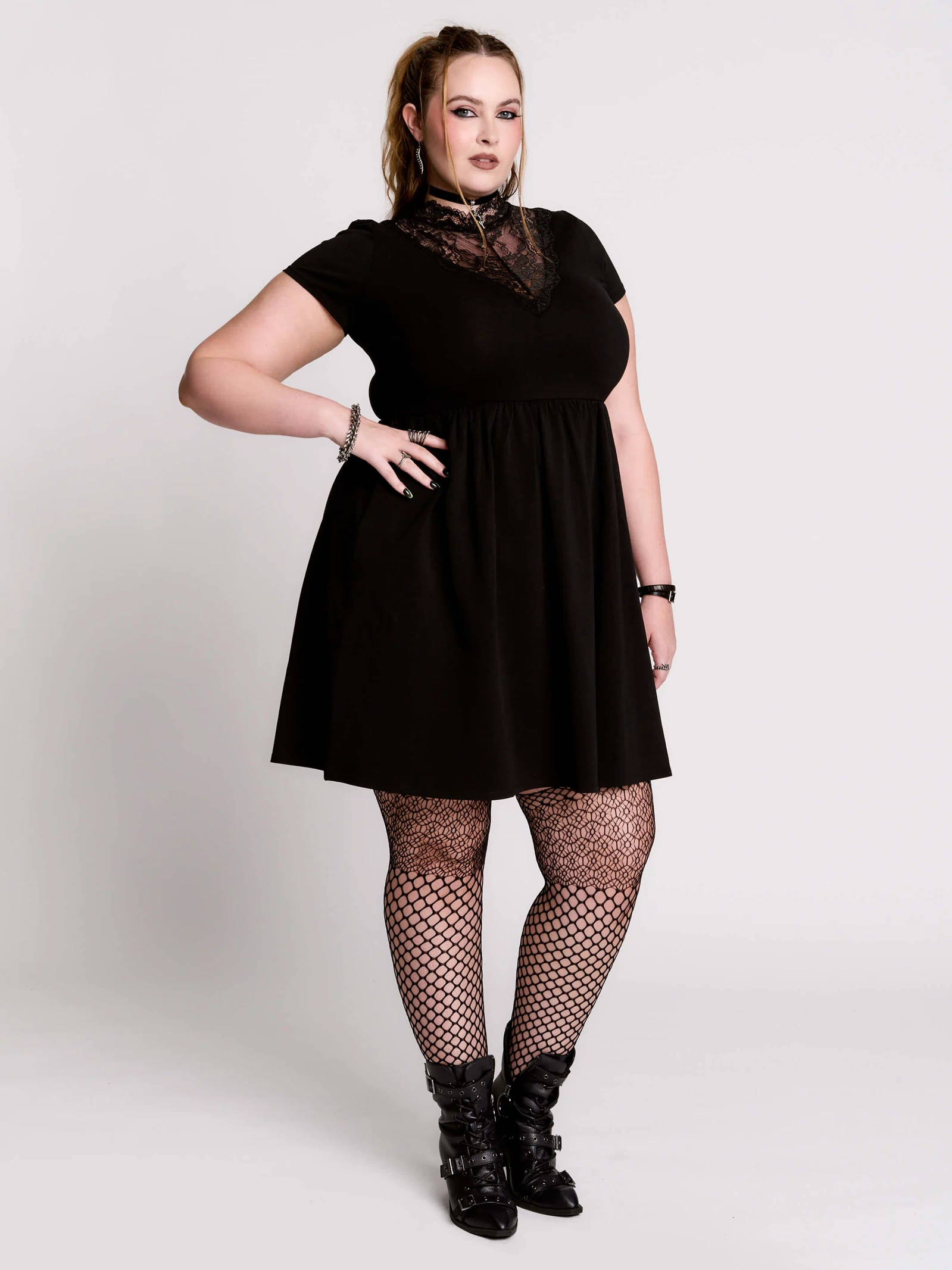 A black short-sleeve dress with a lace V-neckline.