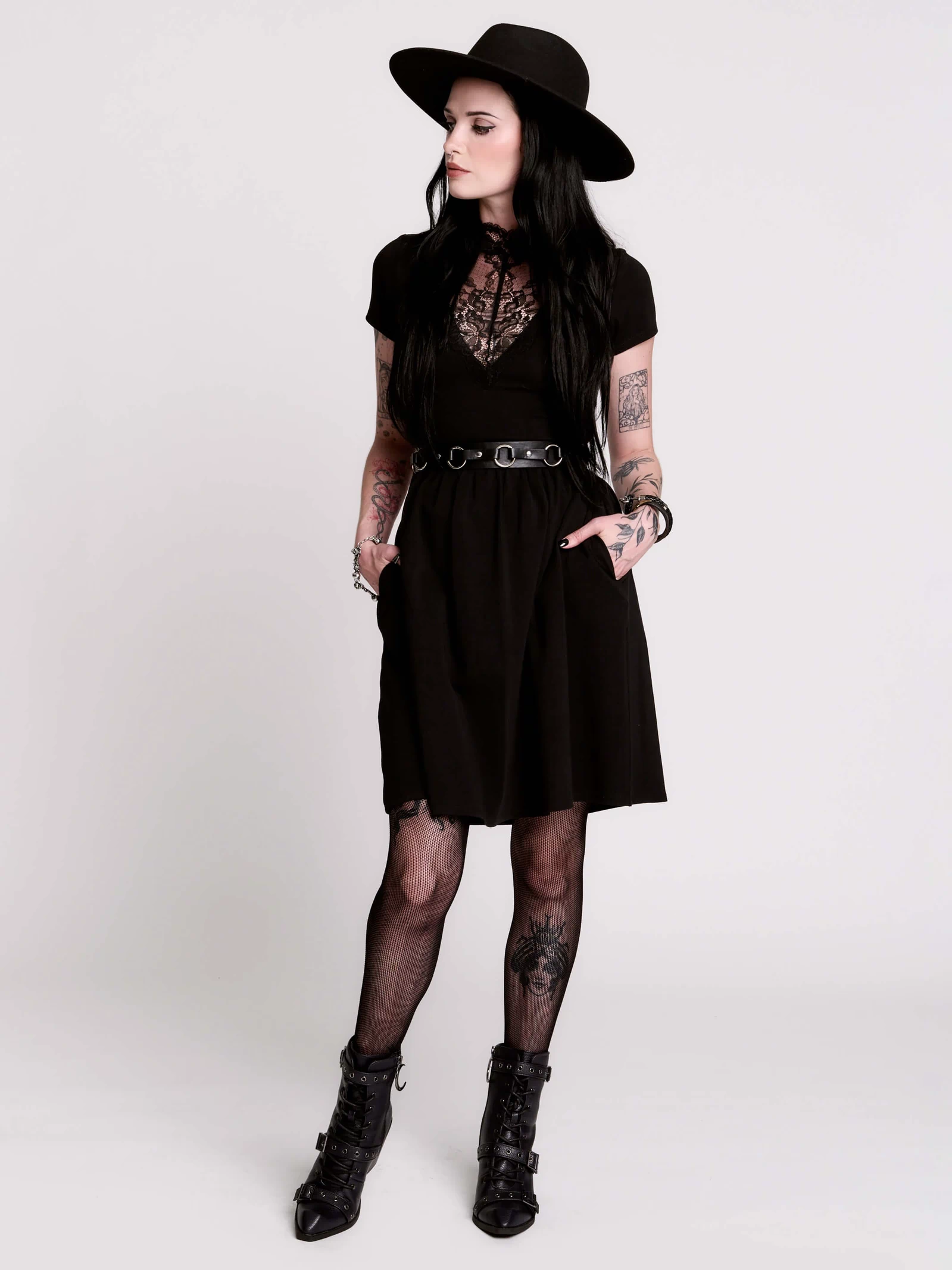 A black short-sleeve dress with a lace V-neckline.