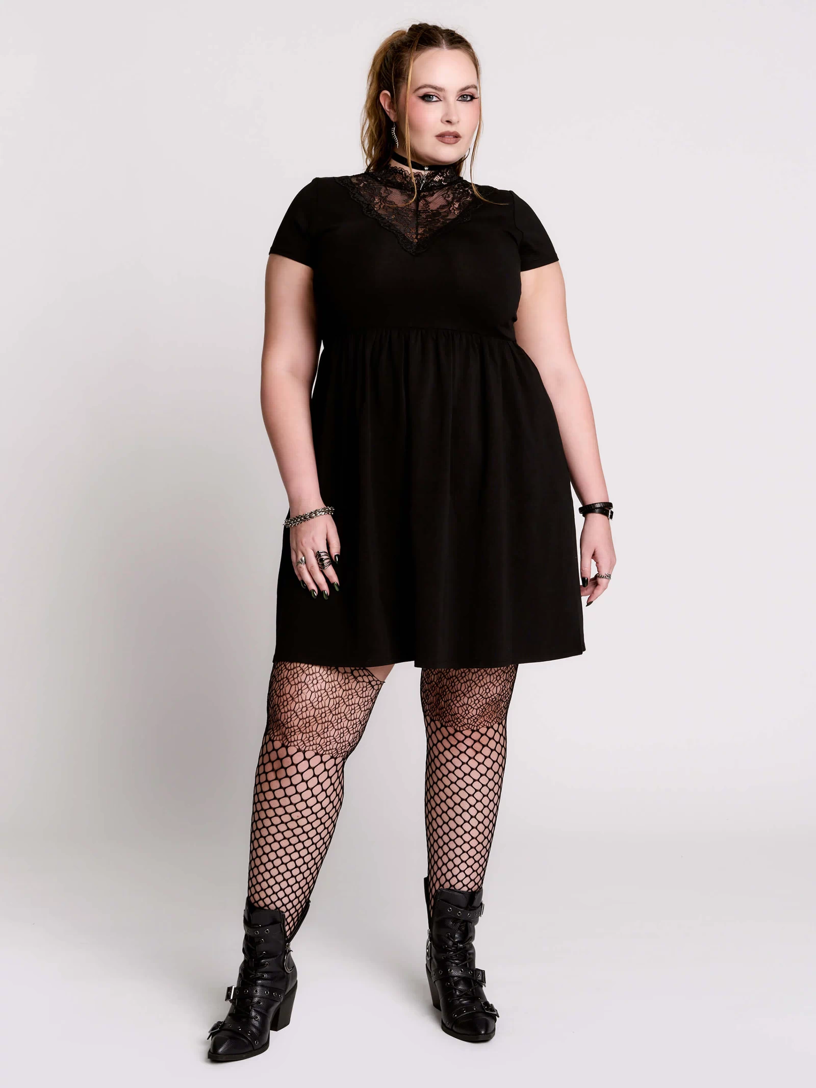 A black short-sleeve dress with a lace V-neckline.