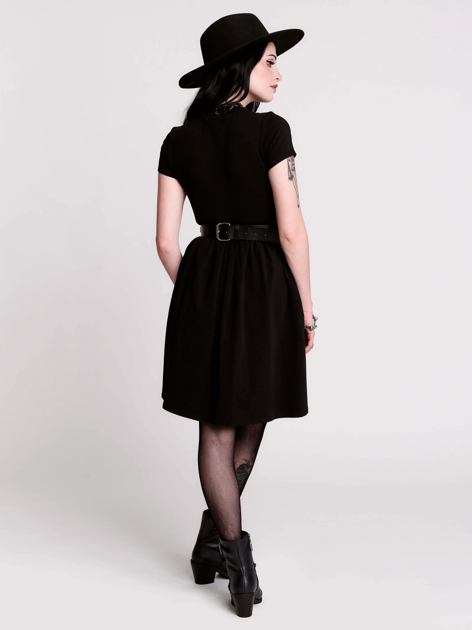 A black short-sleeve dress with a lace V-neckline.