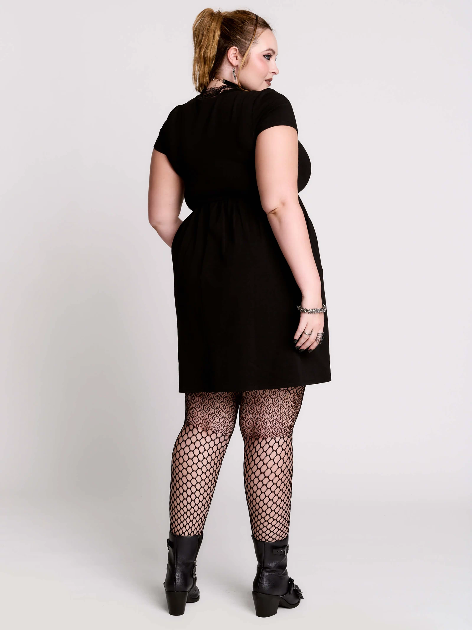 A black short-sleeve dress with a lace V-neckline.