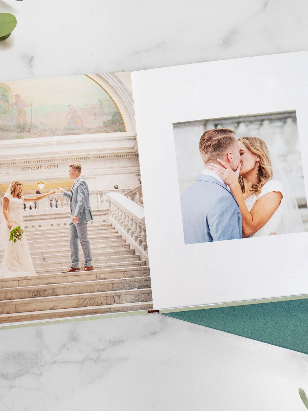 Teal wedding photo album showing 2 different page layouts