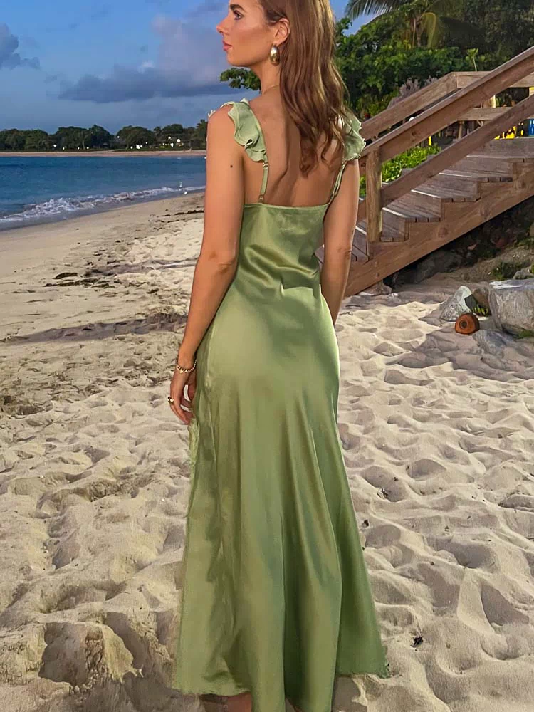 Rear and side view of a sage satin maxi dress with ruffled shoulder straps and a flowy skirt