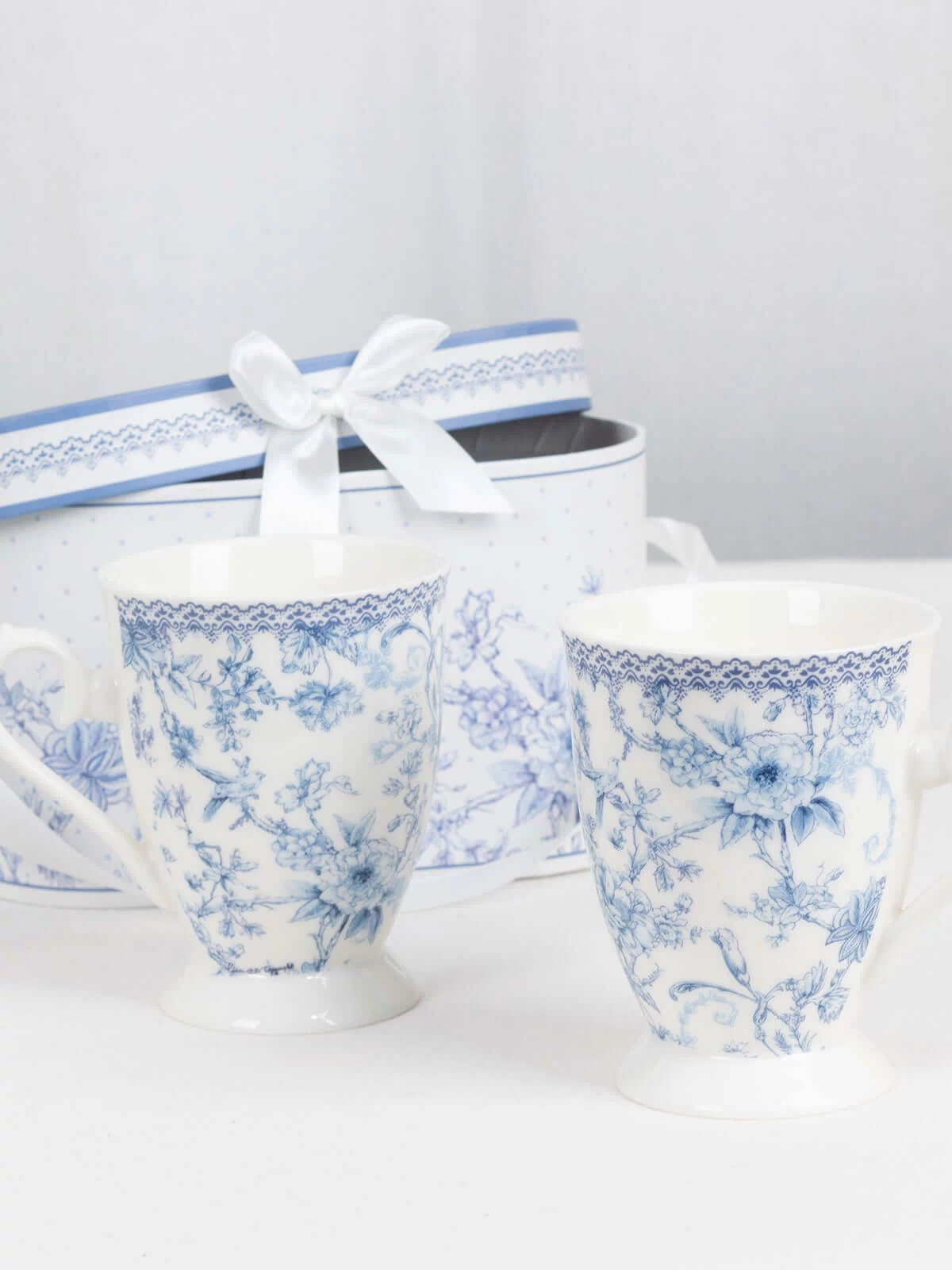 Blue floral ceramic mugs with a matching gift box.