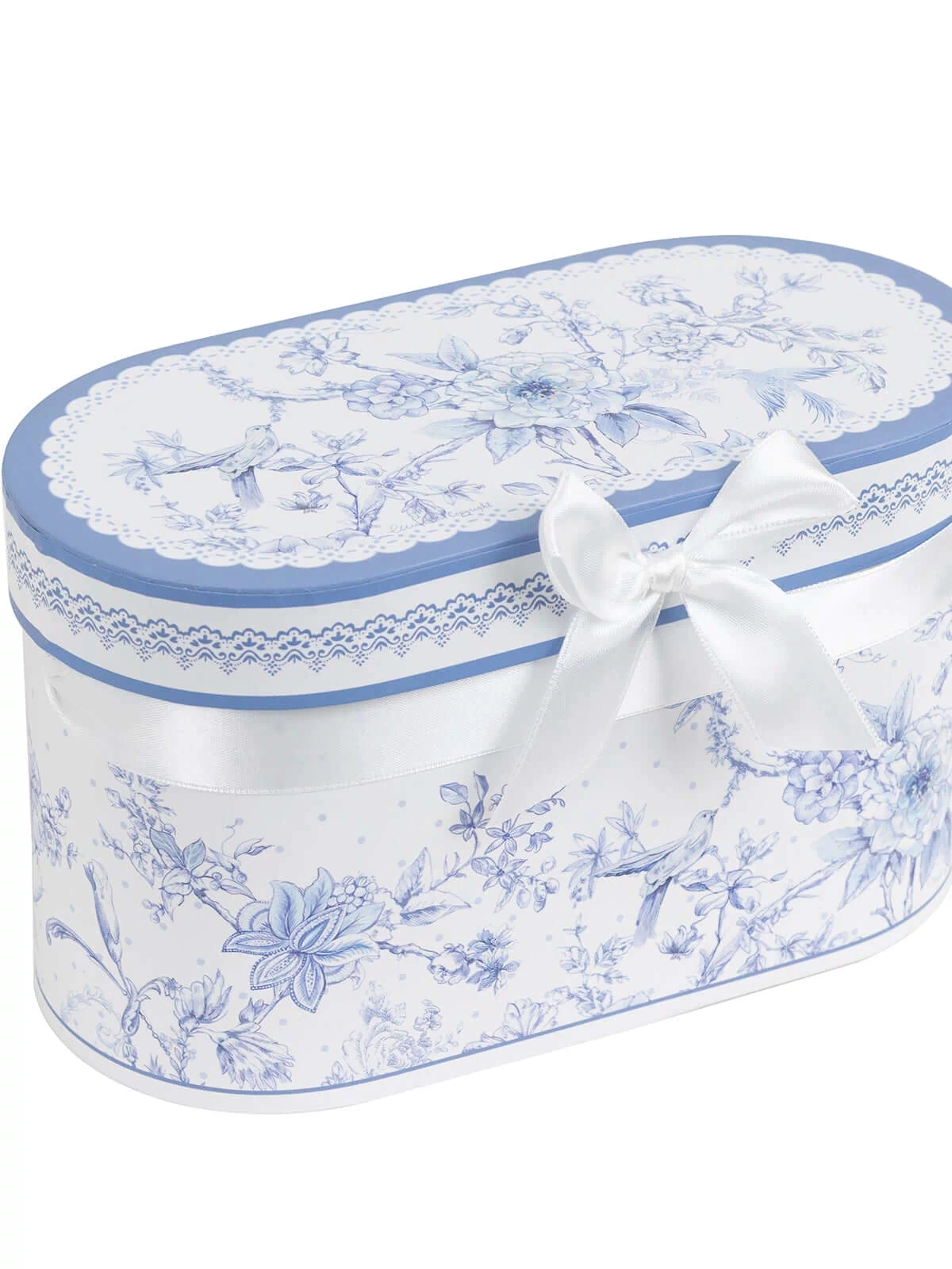 Blue floral design gift box with ribbon bow, studio shot.
