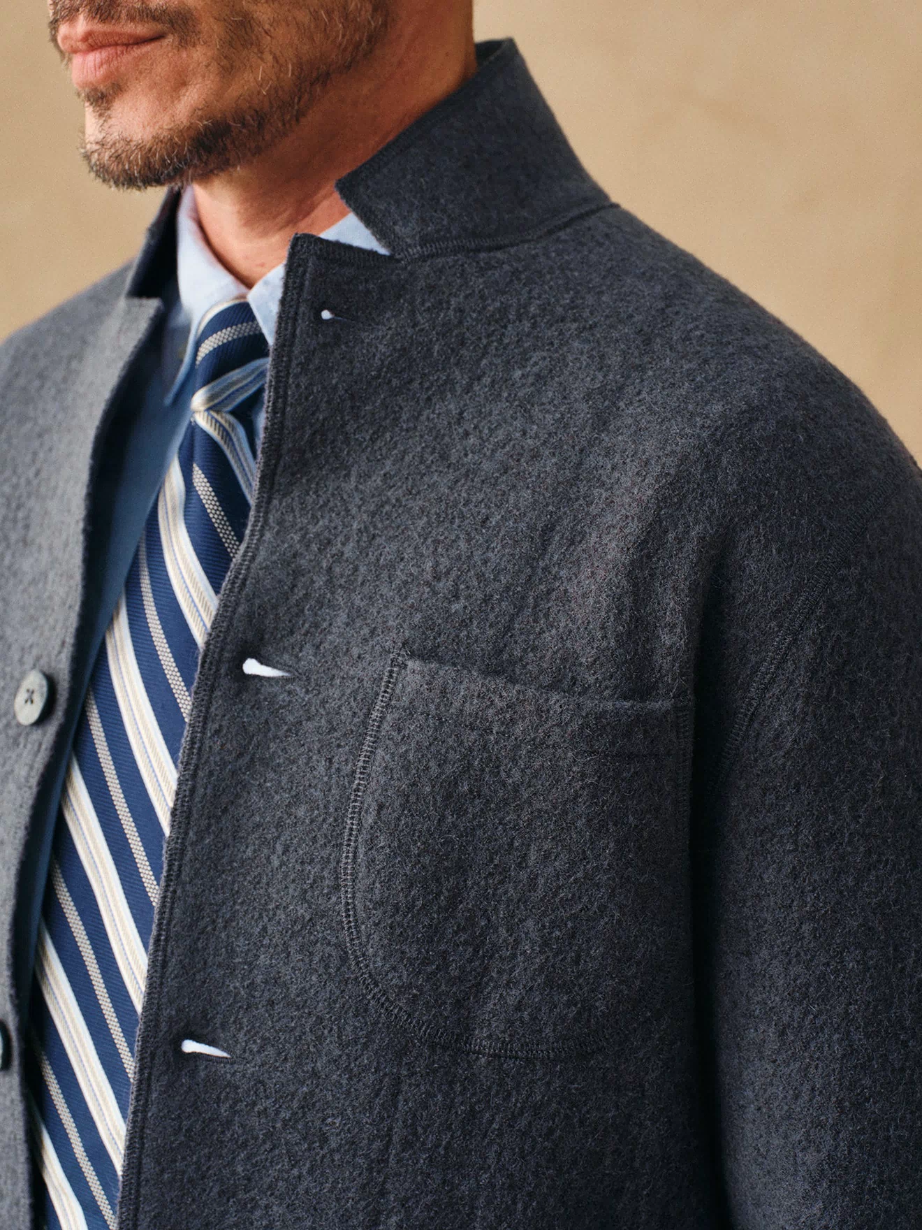 Gray felted wool chore coat chest pocket and button placket detail