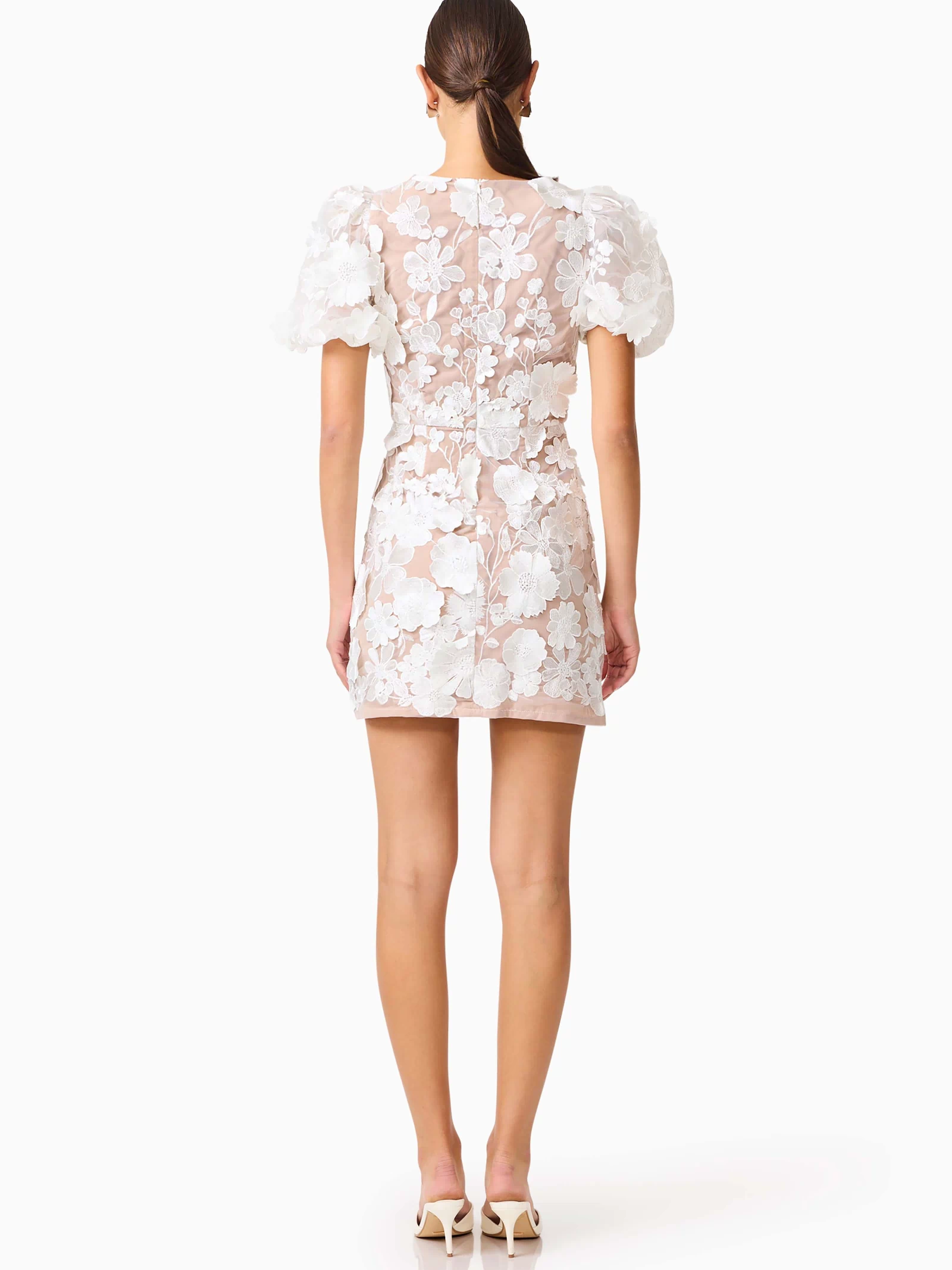 Brunette model wearing Zayla 3D Floral Mini Dress back shot