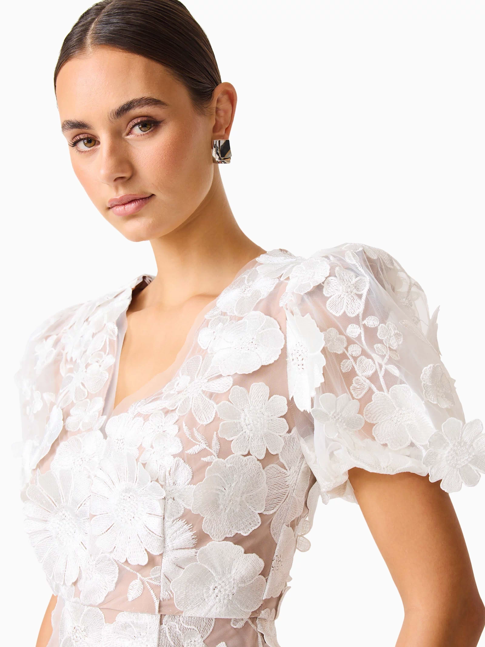 Brunette model wearing Zayla 3D Floral Mini Dress close up posed detail shot